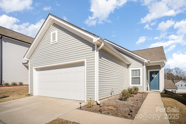 view of front of house with driveway and an attached garage