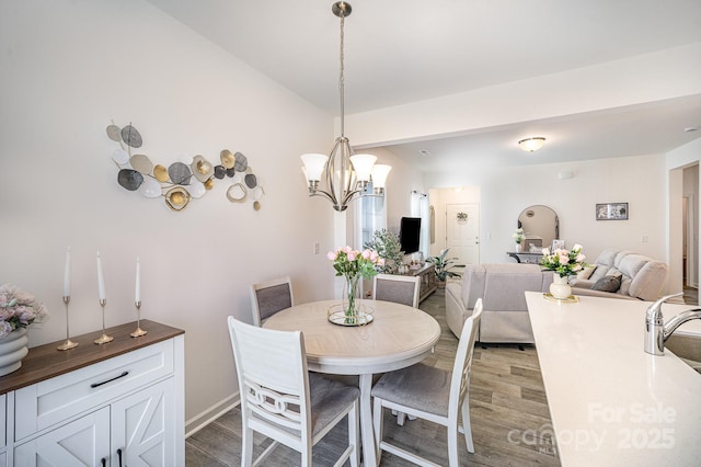 dining space with wood finished floors