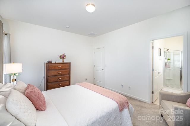 bedroom featuring baseboards, light carpet, visible vents, and connected bathroom