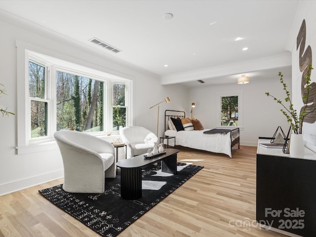 bedroom featuring recessed lighting, visible vents, baseboards, and wood finished floors