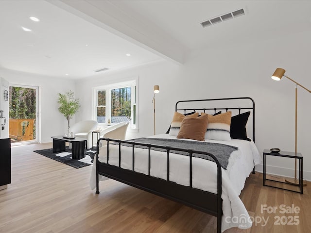 bedroom featuring beam ceiling, recessed lighting, light wood-style floors, and visible vents