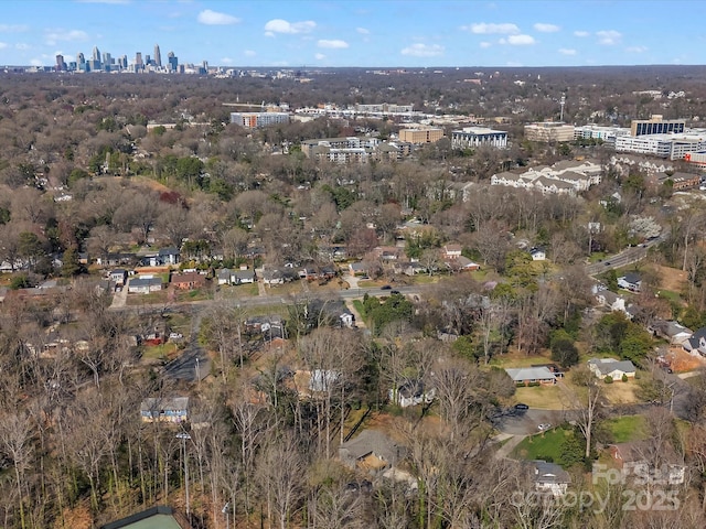 birds eye view of property with a view of city