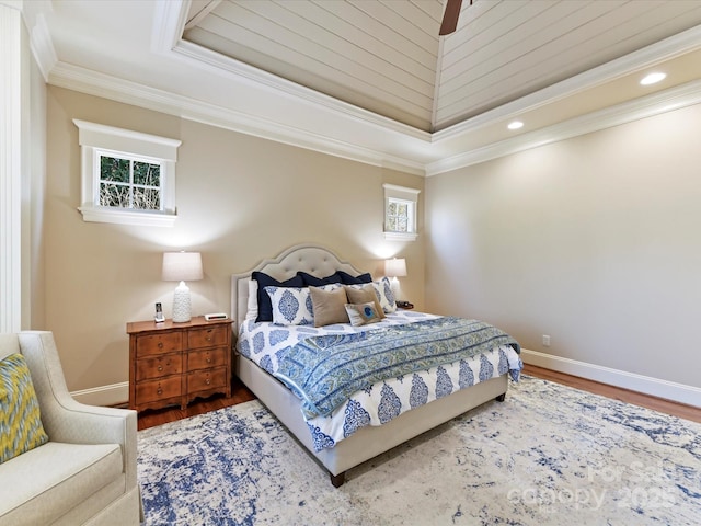 bedroom with recessed lighting, wood finished floors, baseboards, and ornamental molding