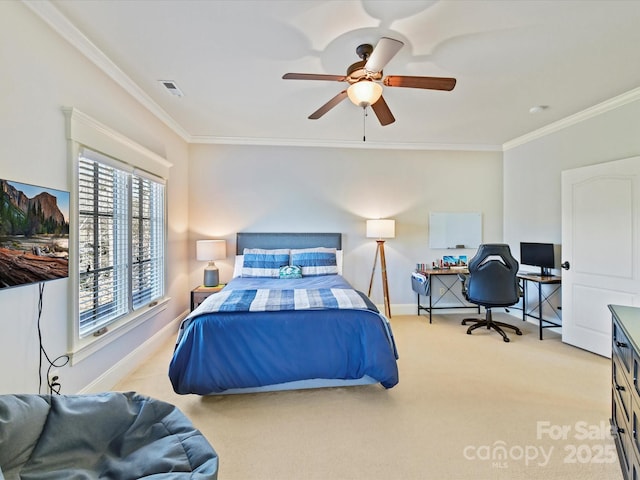 bedroom with ceiling fan, baseboards, carpet floors, and ornamental molding