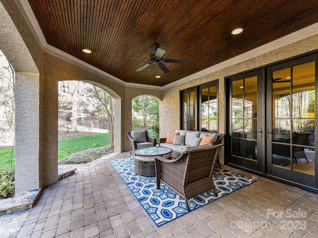 view of patio / terrace featuring french doors, outdoor lounge area, and a ceiling fan