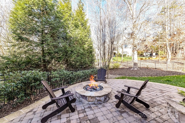 view of patio / terrace featuring fence and an outdoor fire pit