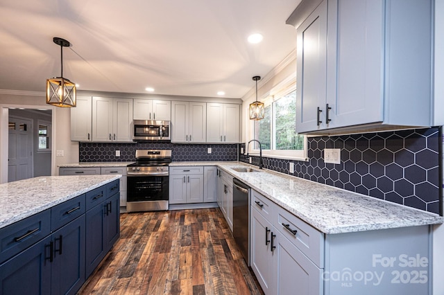 kitchen with tasteful backsplash, light stone countertops, dark wood-style floors, stainless steel appliances, and a sink