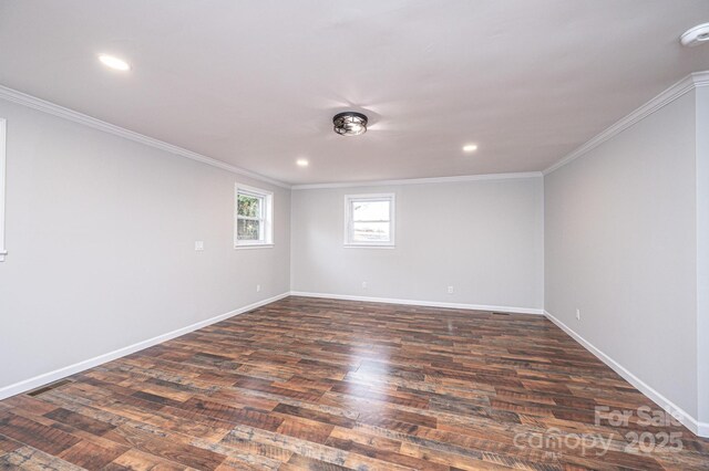 unfurnished room featuring dark wood finished floors, recessed lighting, crown molding, and baseboards