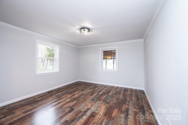 unfurnished room featuring dark wood finished floors, plenty of natural light, baseboards, and ornamental molding