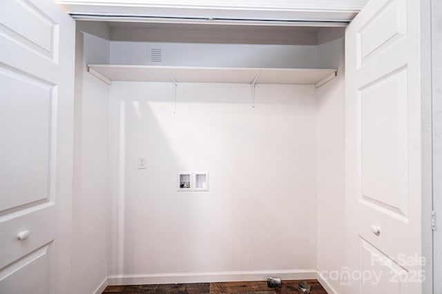 washroom featuring washer hookup, laundry area, baseboards, and dark wood-type flooring