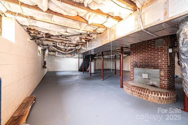 unfinished basement with gas water heater