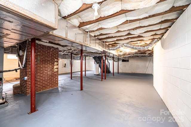 unfinished basement with water heater