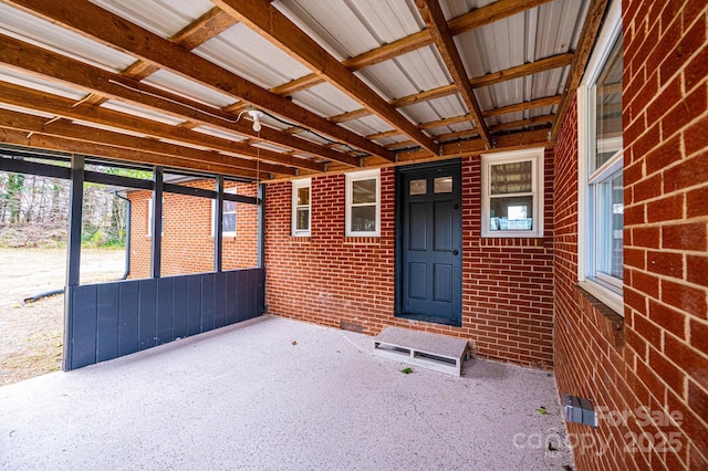 entrance to property with brick siding