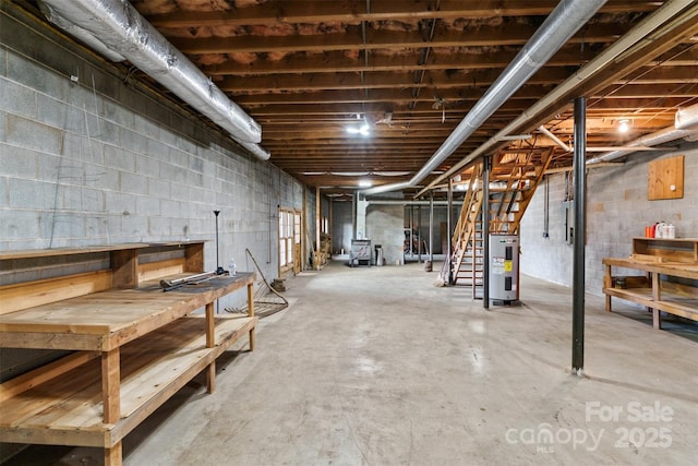 unfinished basement featuring electric panel, stairway, and electric water heater