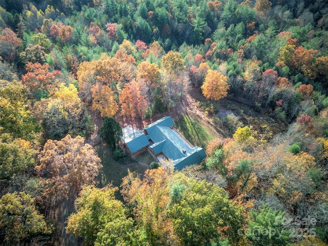 bird's eye view featuring a forest view