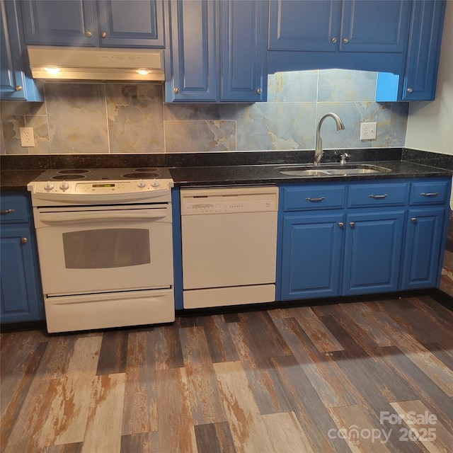 kitchen with a sink, white appliances, blue cabinetry, and under cabinet range hood