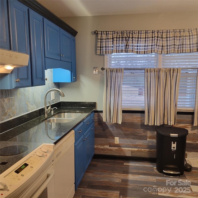 kitchen featuring stove, dark wood-type flooring, white dishwasher, a sink, and blue cabinets