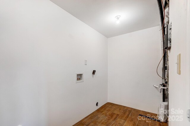 laundry room featuring laundry area, wood finished floors, and washer hookup