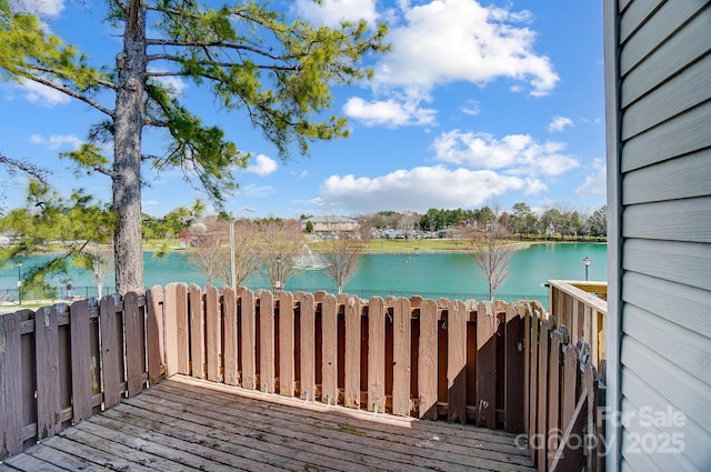 wooden deck with a water view