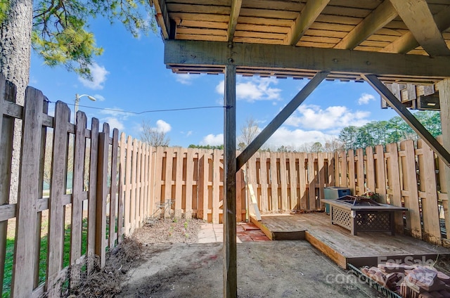 view of patio / terrace featuring a fire pit and a fenced backyard