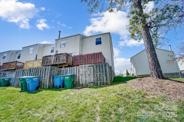 back of property featuring a lawn