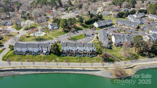 bird's eye view featuring a residential view and a water view