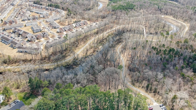 drone / aerial view with a view of trees