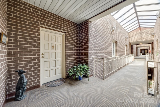 entrance to property with brick siding