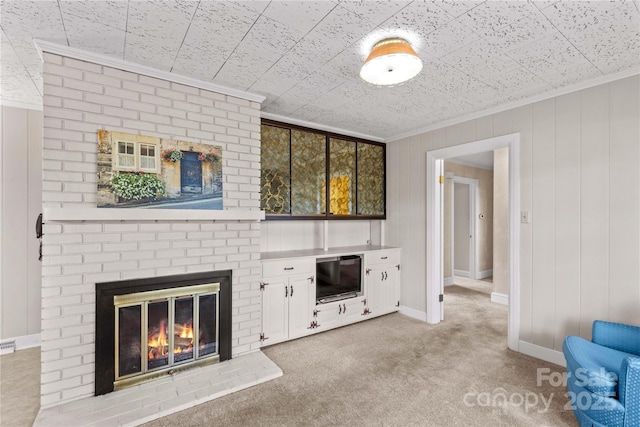 unfurnished living room with a fireplace, light colored carpet, baseboards, and ornamental molding