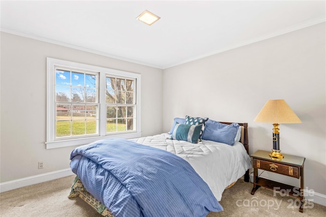 carpeted bedroom with baseboards and ornamental molding