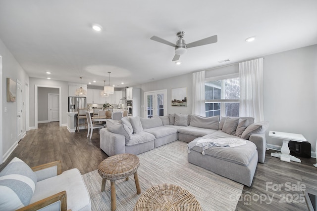 living area featuring recessed lighting, baseboards, ceiling fan, and dark wood finished floors