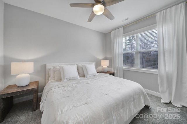 bedroom featuring a ceiling fan, baseboards, visible vents, and carpet floors