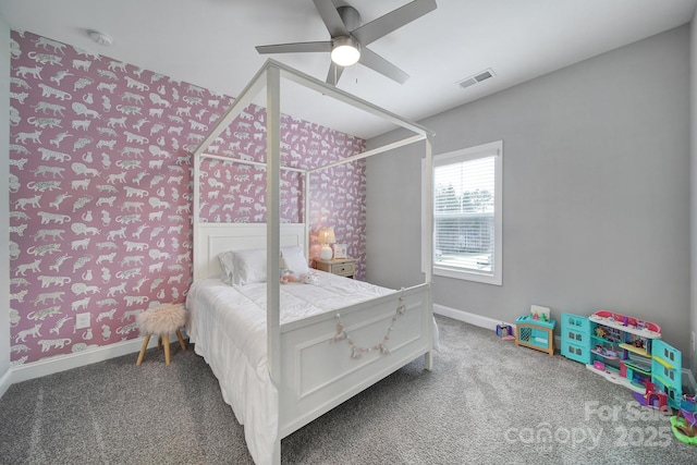 bedroom with baseboards, visible vents, carpet floors, and ceiling fan