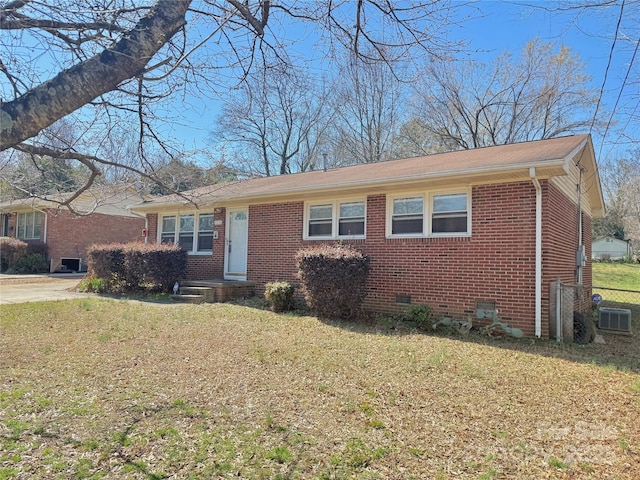 view of front of home with crawl space, a front lawn, and brick siding