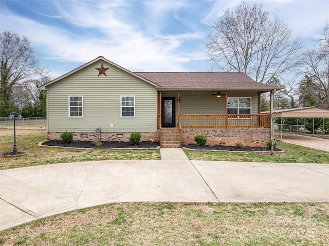 single story home featuring a porch, fence, a detached carport, concrete driveway, and crawl space