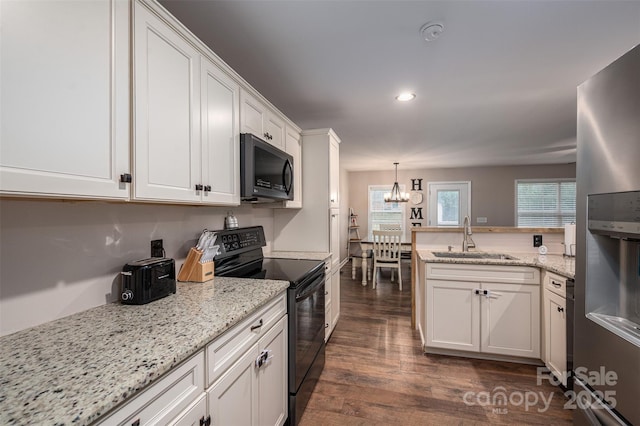 kitchen featuring a sink, black range with electric stovetop, white cabinets, stainless steel fridge, and dark wood-style flooring