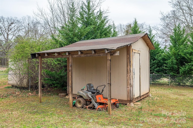 view of shed with fence