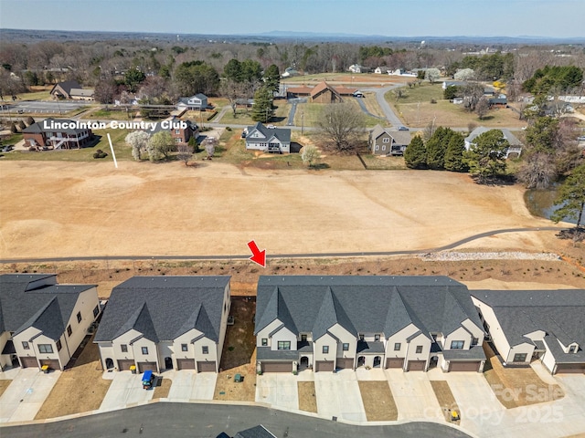 birds eye view of property with a residential view