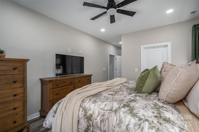 bedroom with recessed lighting, visible vents, baseboards, and dark wood-type flooring