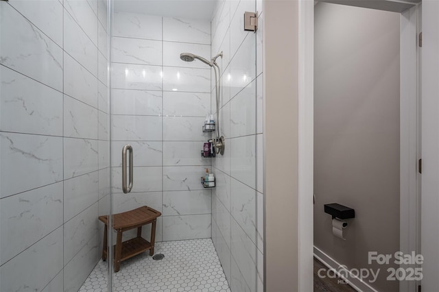 full bath featuring a shower stall