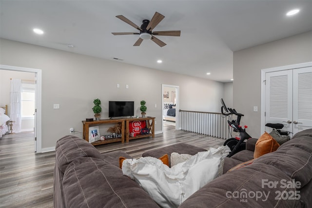 living room featuring wood finished floors, recessed lighting, a ceiling fan, and visible vents