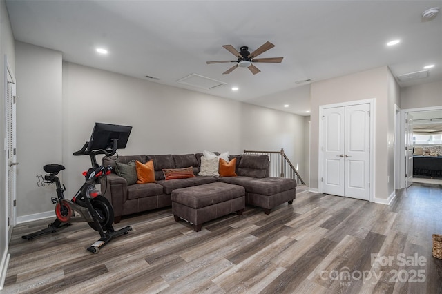 living area with a ceiling fan, wood finished floors, visible vents, baseboards, and recessed lighting