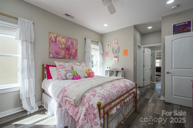 bedroom with dark wood-style floors, visible vents, baseboards, recessed lighting, and ceiling fan