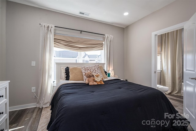 bedroom featuring visible vents, baseboards, ensuite bath, recessed lighting, and dark wood-style flooring