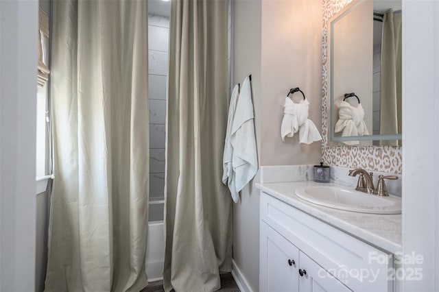 bathroom with vanity and shower / bath combo with shower curtain