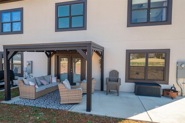 view of patio with a grill, french doors, and an outdoor hangout area