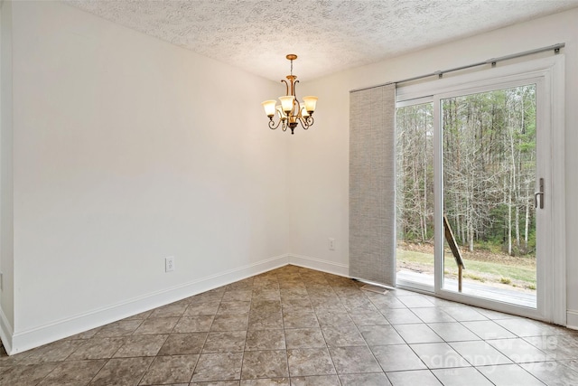 tiled empty room featuring a textured ceiling, visible vents, baseboards, and a chandelier