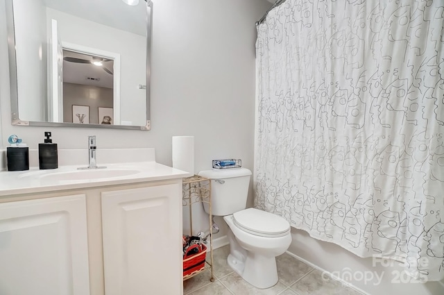 bathroom with tile patterned flooring, shower / bath combination with curtain, toilet, and vanity