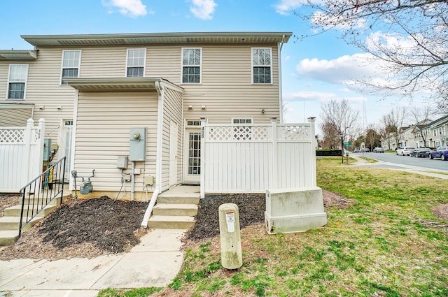 view of front of house with fence