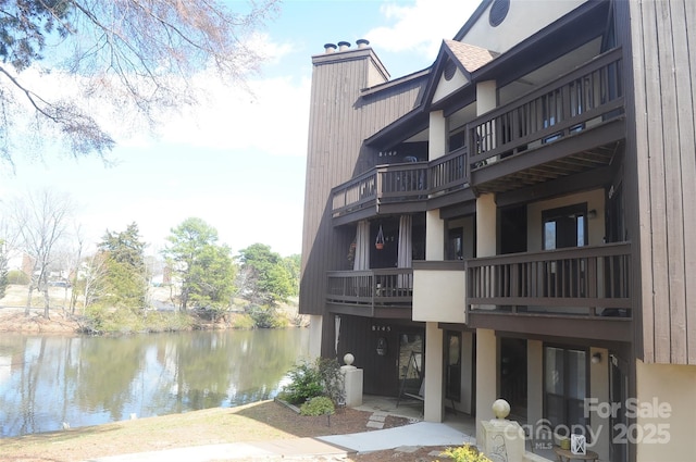 view of building exterior with a water view